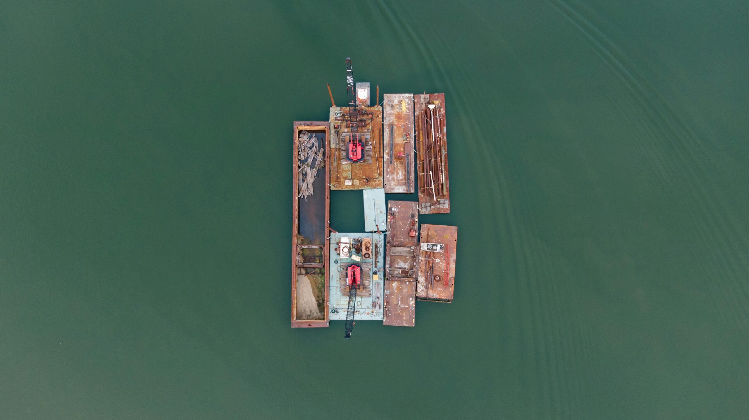 Drone view of barges on the water in Tennessee, showcasing industrial transportation.